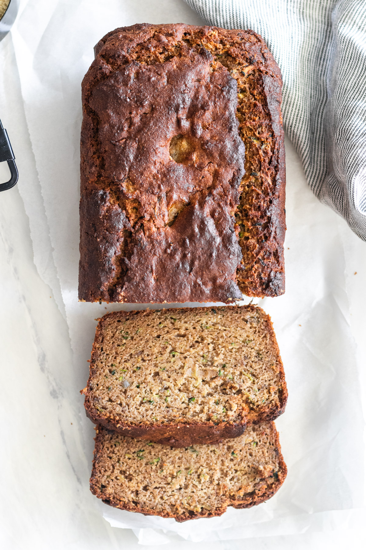 Loaf of bread made with zucchini, sliced.