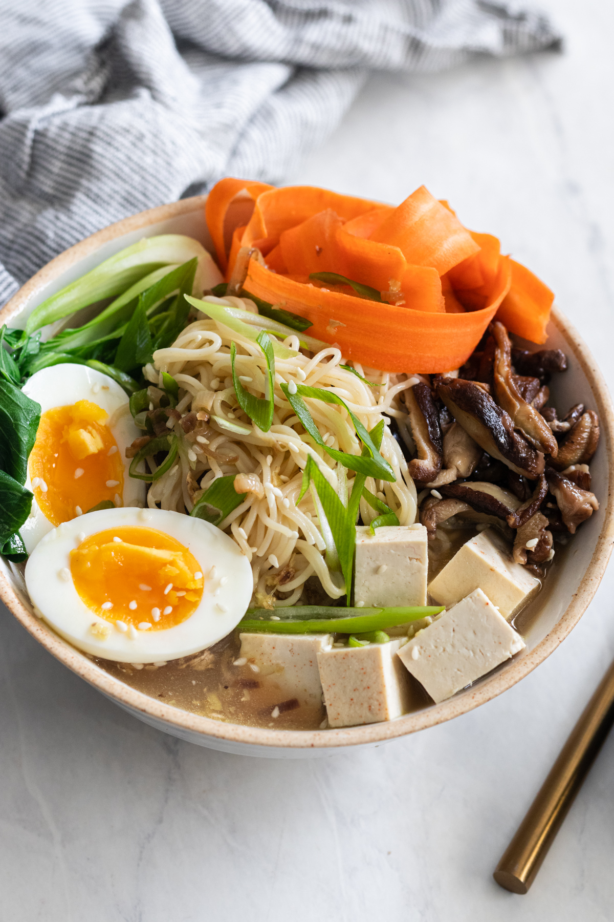 Gluten free ramen with shiitake, carrots, bok choy and tofu.